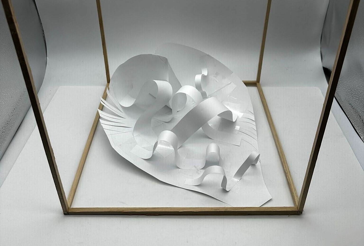 Paper model inside a wooden display frame