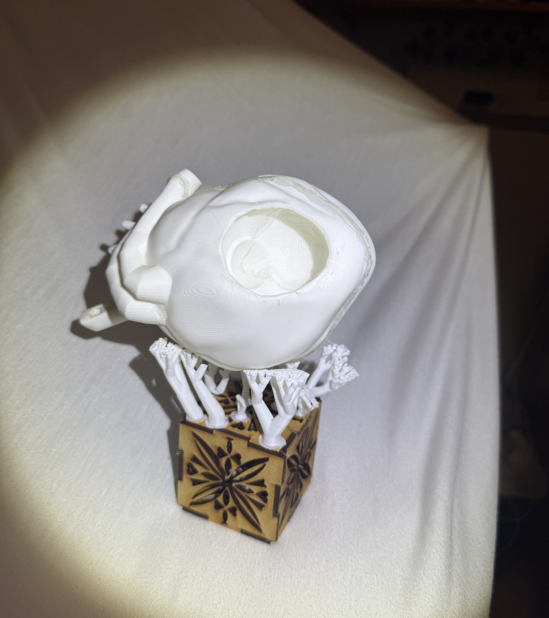 The finished 3D-printed sound vessel, lit from the side